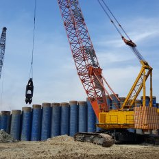 Excavation inside tubular piles using grab hammer